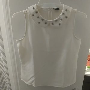 White blouse with stone accents